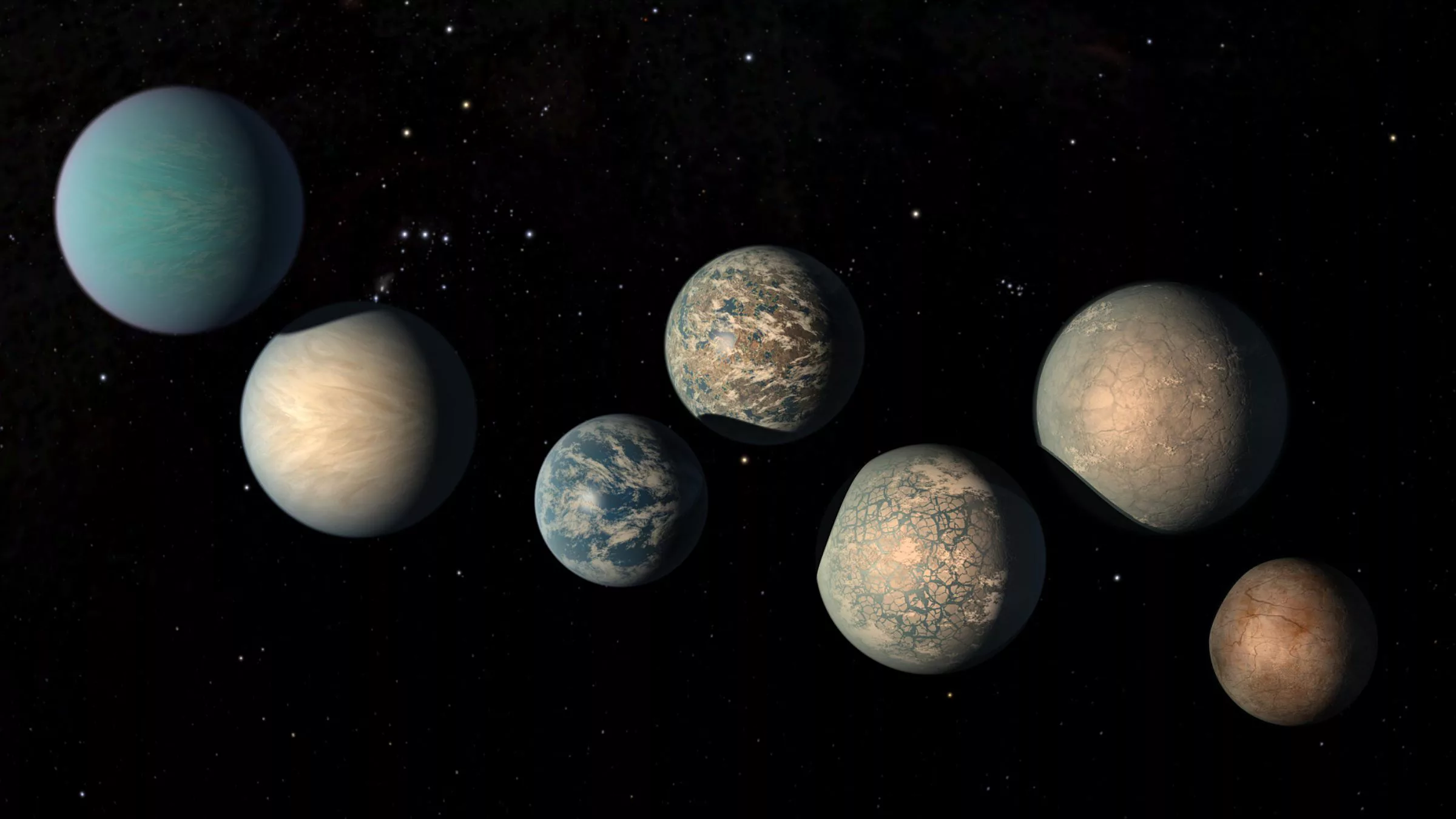 Este conceito artístico ilustra os planetas do sistema TRAPPIST-1. O sistema TRAPPIST-1 é um dos mais estudados devido ao seu grupo compacto de planetas que orbitam uma estrela anã ultrafria. A imagem mostra como esses planetas podem parecer, com base nas informações disponíveis e nas simulações feitas pelos cientistas.